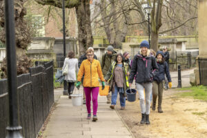 A commuity group walking towards the camera